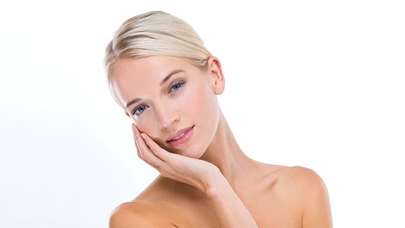 woman skincare beauty studio portrait with hand face results wellness glow by white background girl person model with cosmetics facial skin transformation with pride